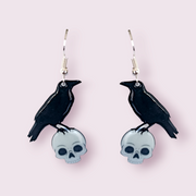 If you've been around a while, you'll notice the adorable raven in these earrings, is the same one found on my logo. These stunning earrings are designed and made in-house. Material: shrink film, resin, nickel free hooks. Please note as these are all handmade, minor differences may occur from piece to piece. All shrink film products can take about a week to send out as they are currently made to order